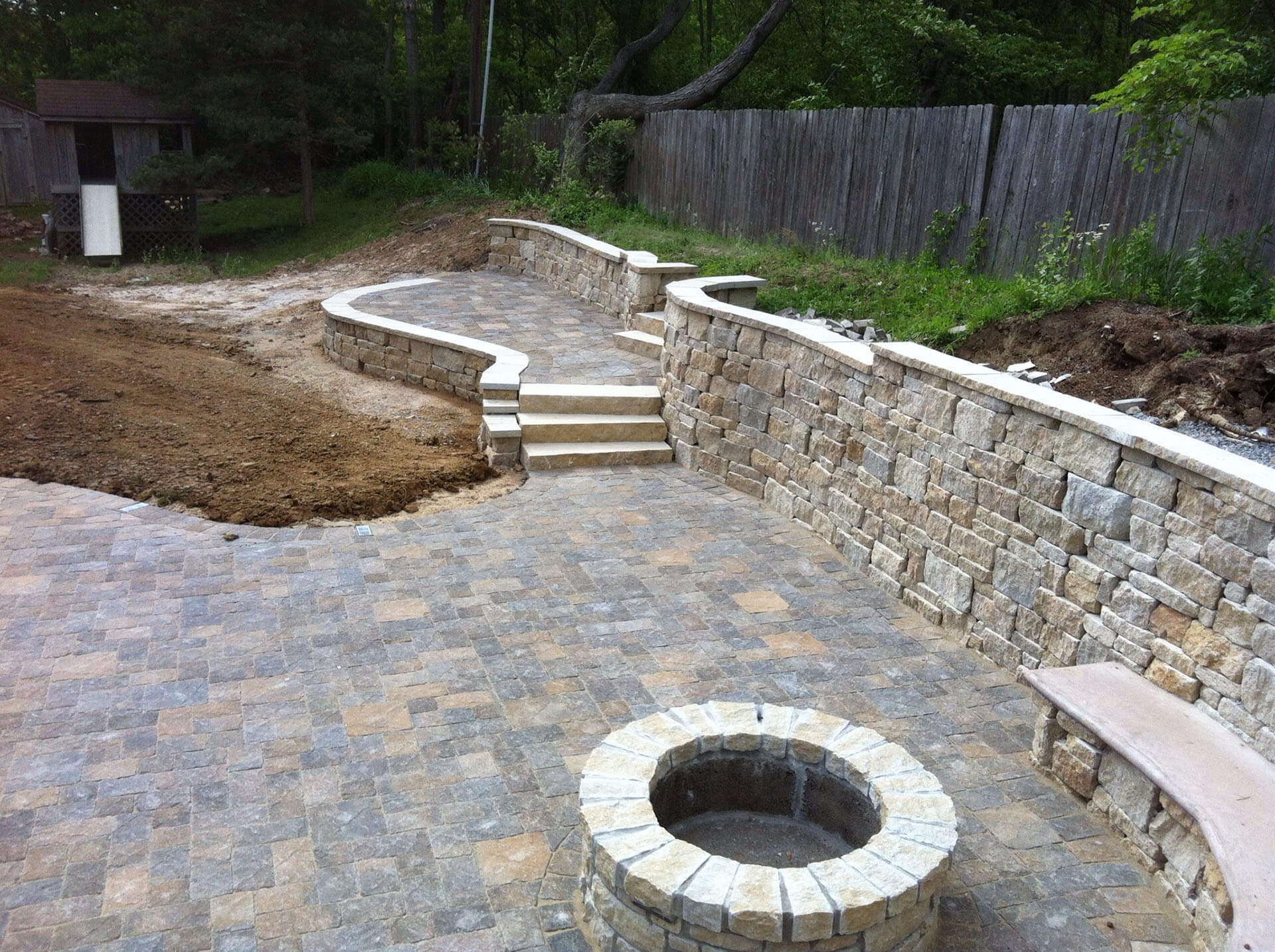 stone plaza and retaining walls in a yard Cape Girardeau, MO Project