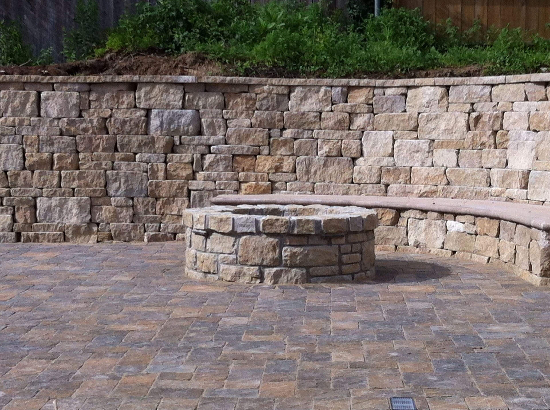 stone plaza with fire pit in a yard Cape Girardeau, MO Project