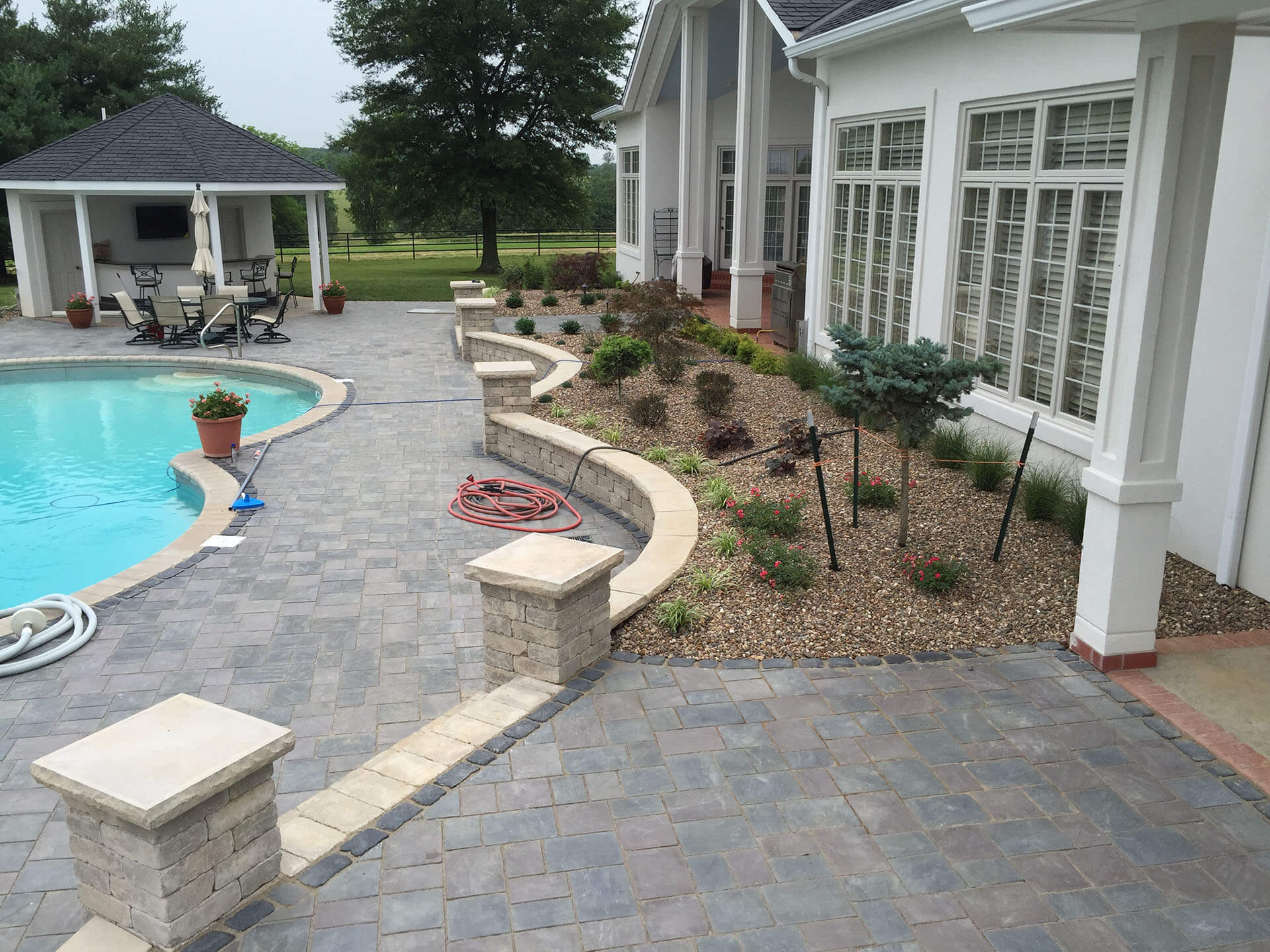 natural stone pool deck and retaining walls for a home in Jackson, MO Project