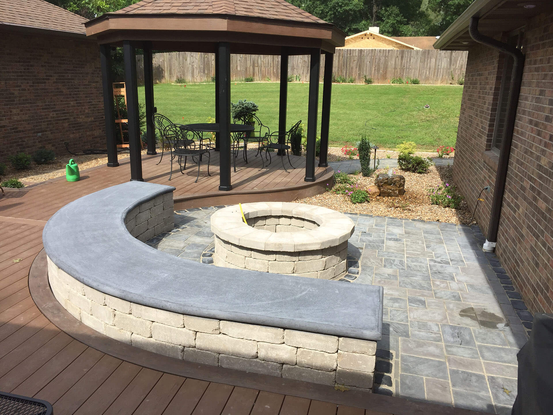 stone fire pit and curbed stone bench Cape Girardeau, MO Project