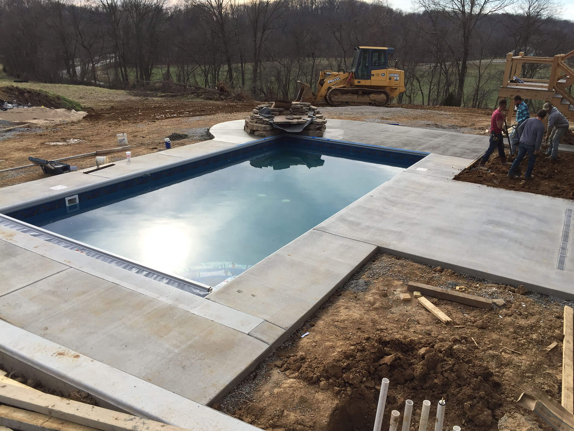 swimming pool project features natural stone deck, waterfall Cape Girardeau, MO Project
