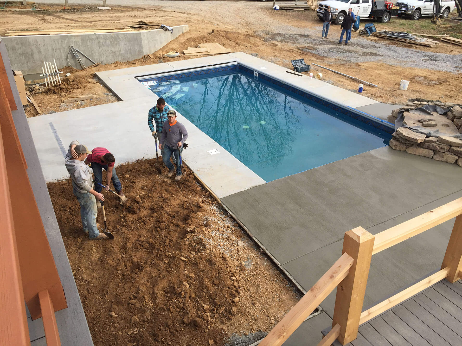 building a swimming pool deck with a stone waterfall feature Cape Girardeau, MO Project