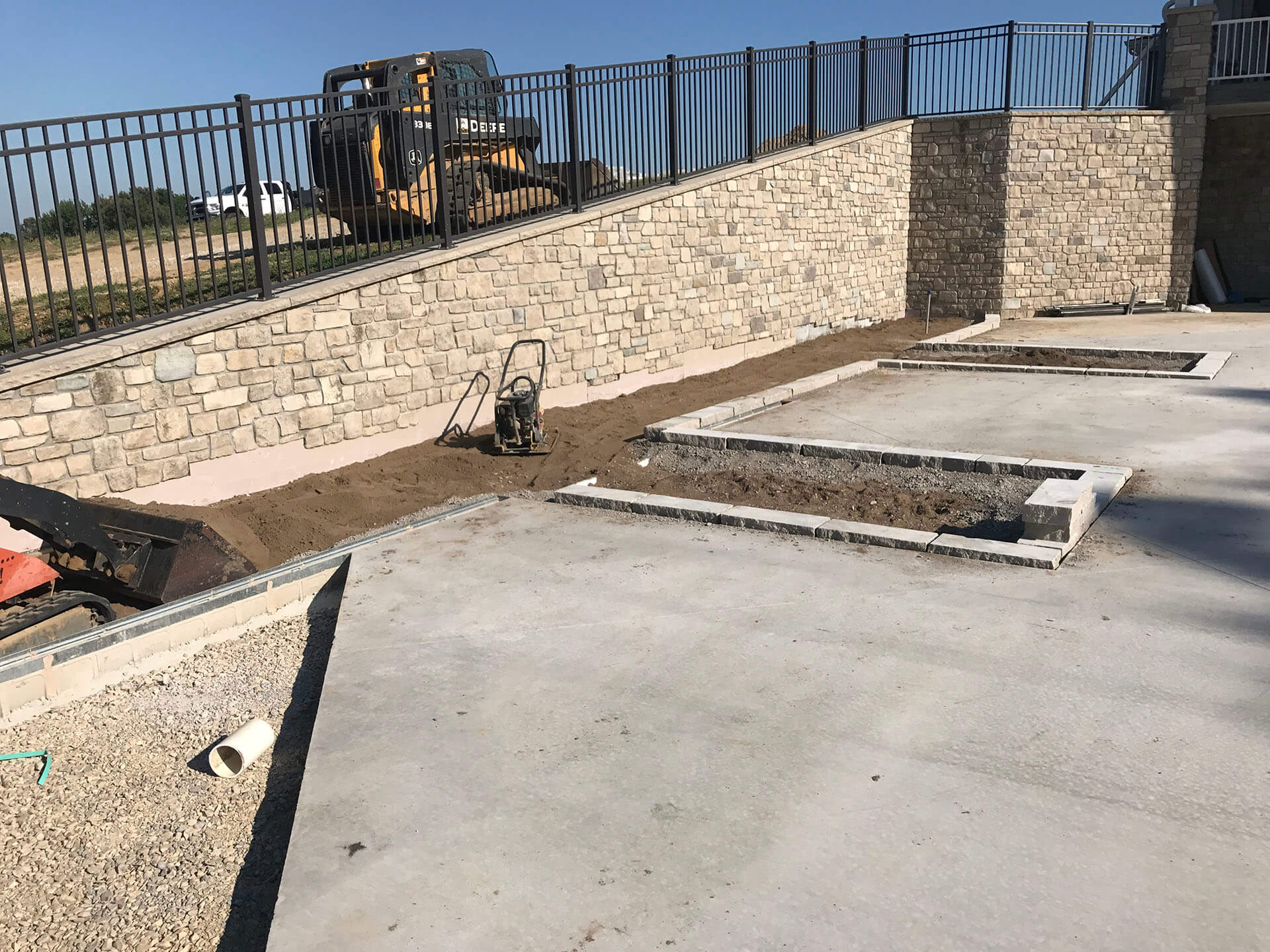 retaining wall with stone patio Dexter, MO Project