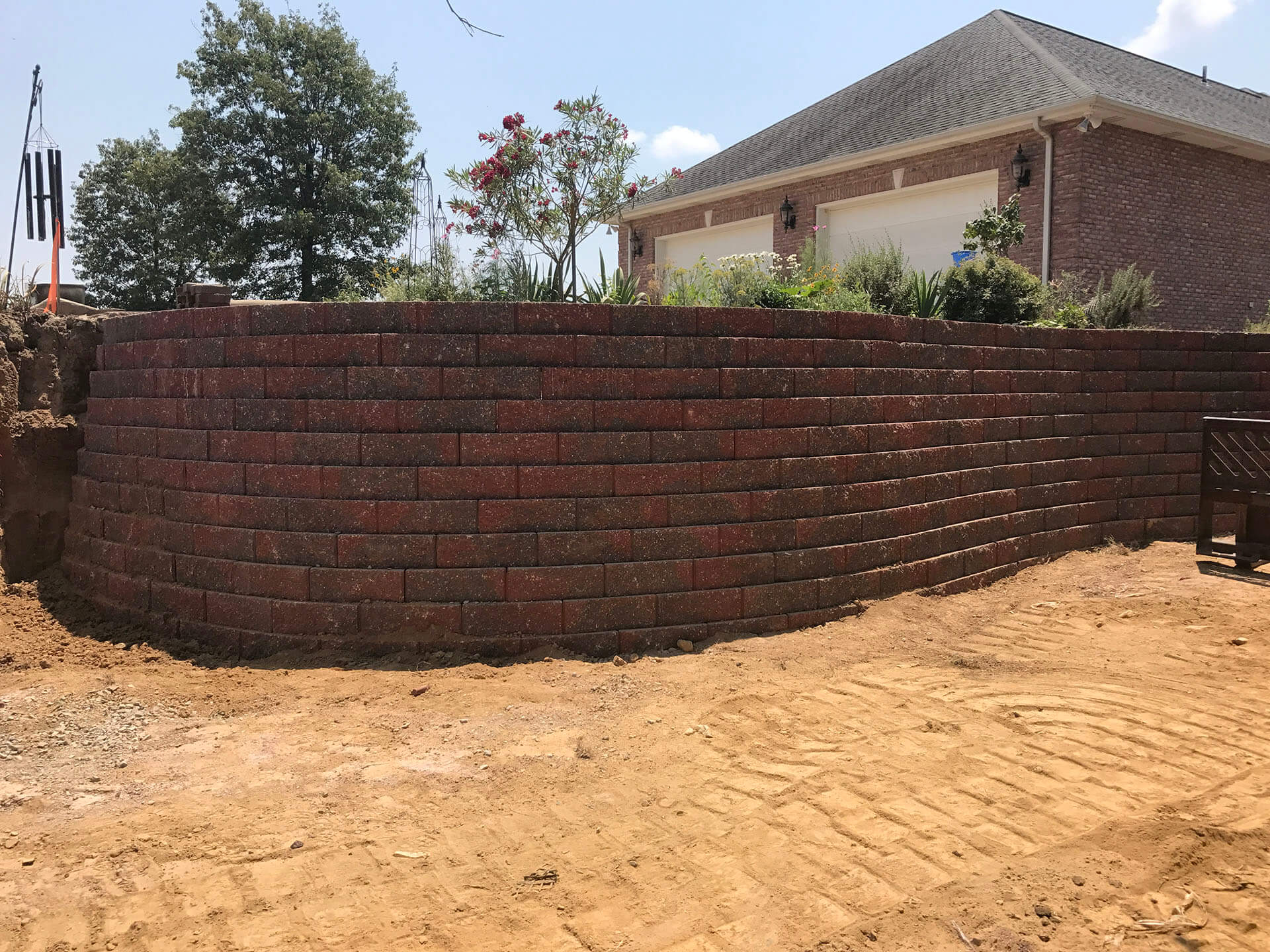 retaining wall of interlocking stones at a home in Dexter, MO Project