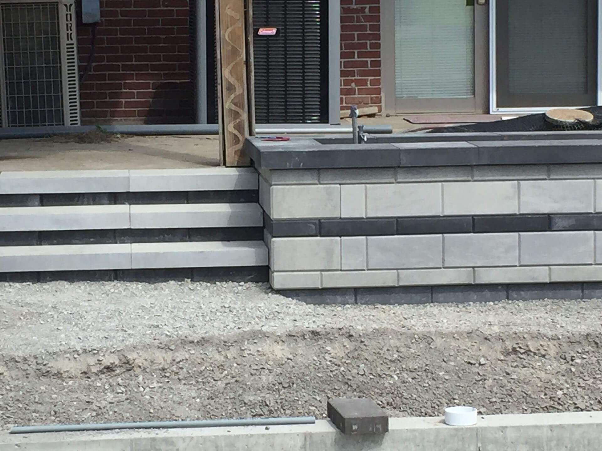 white, black and gray stone steps and walls in a landscaping project Cape Girardeau, MO Project