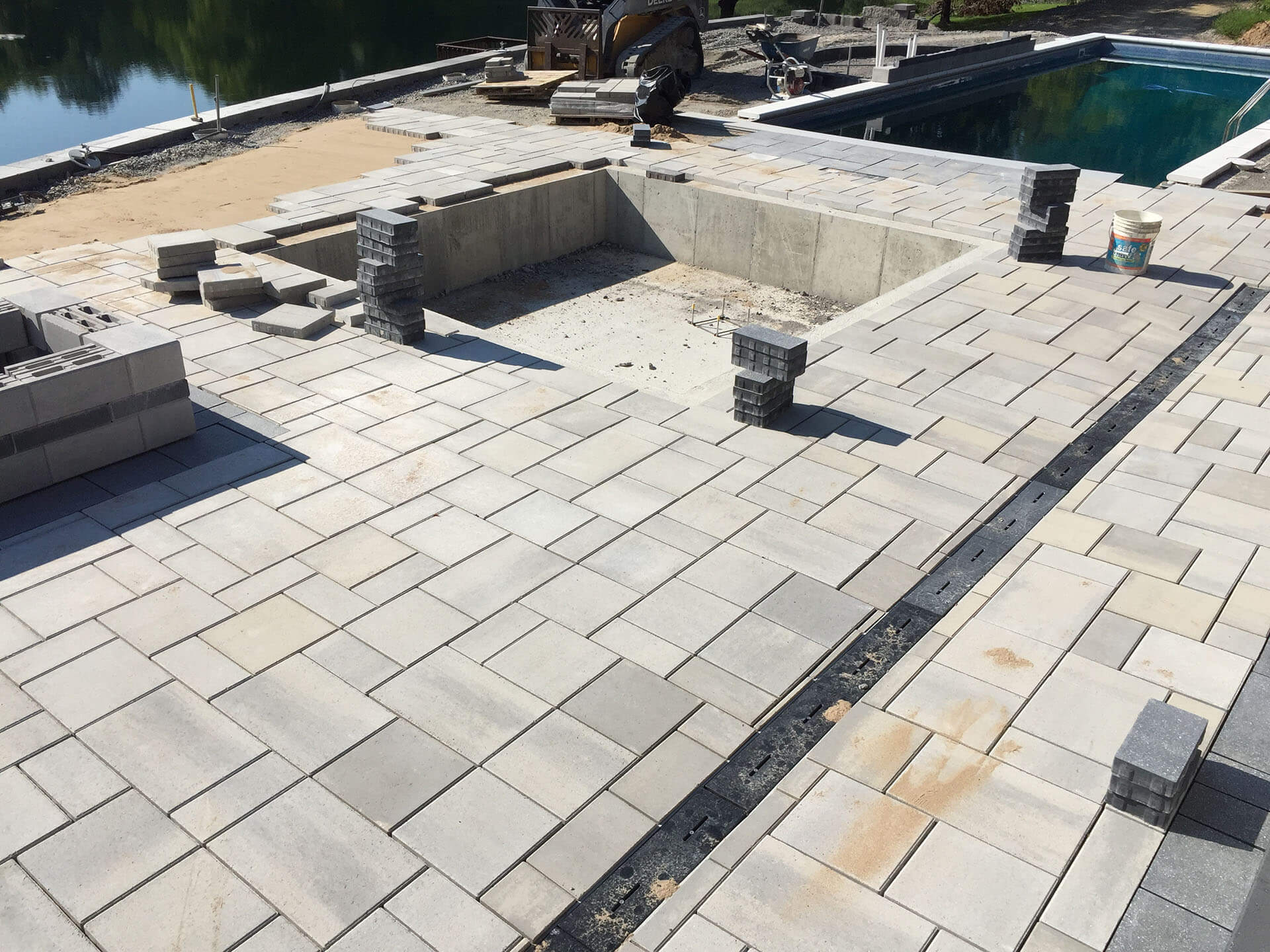 installing a gray and white flagstone patio and pool deck Cape Girardeau, MO Project