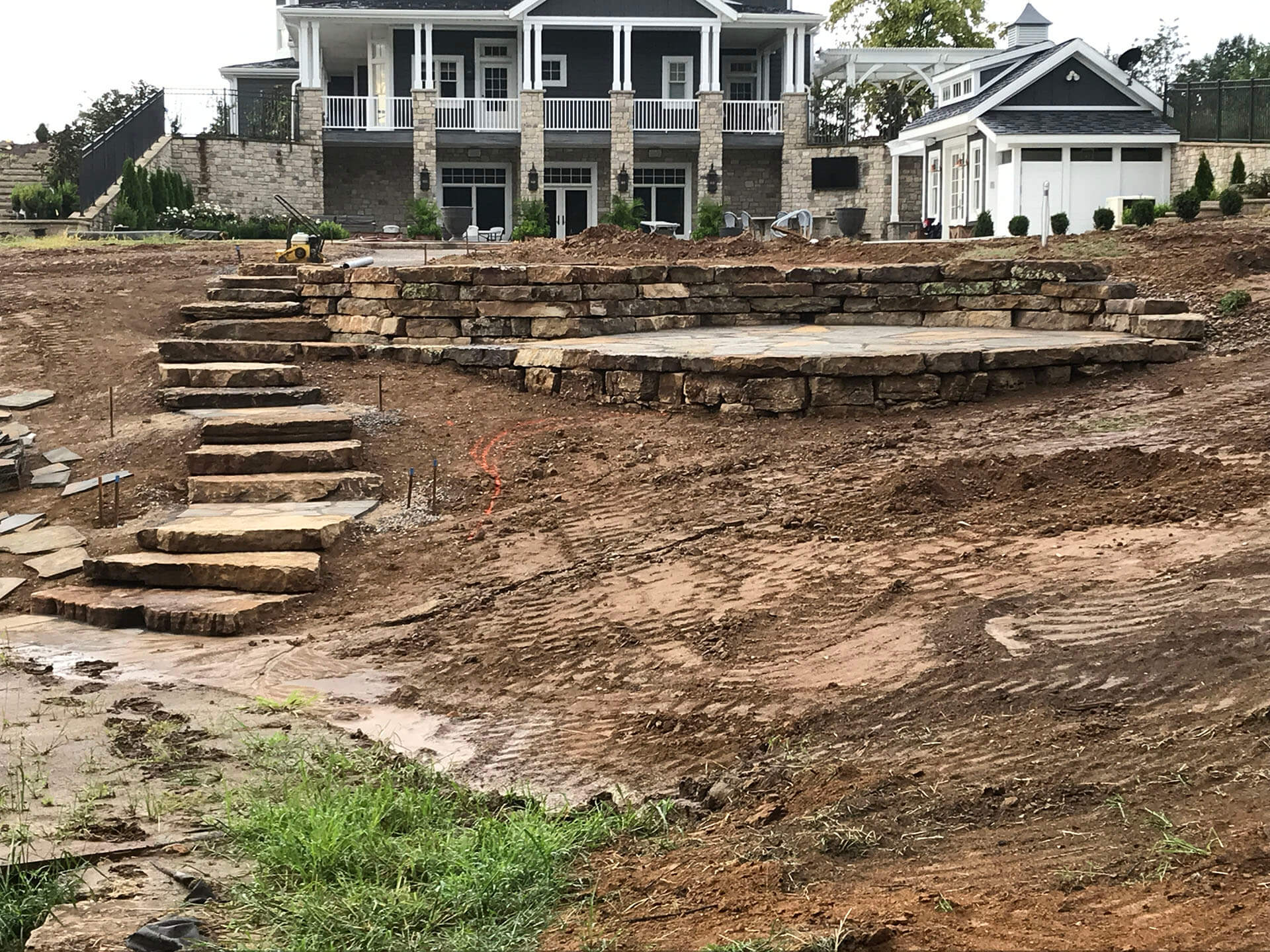 landscaping wiht stone patio and walkways Dexter, MO Project