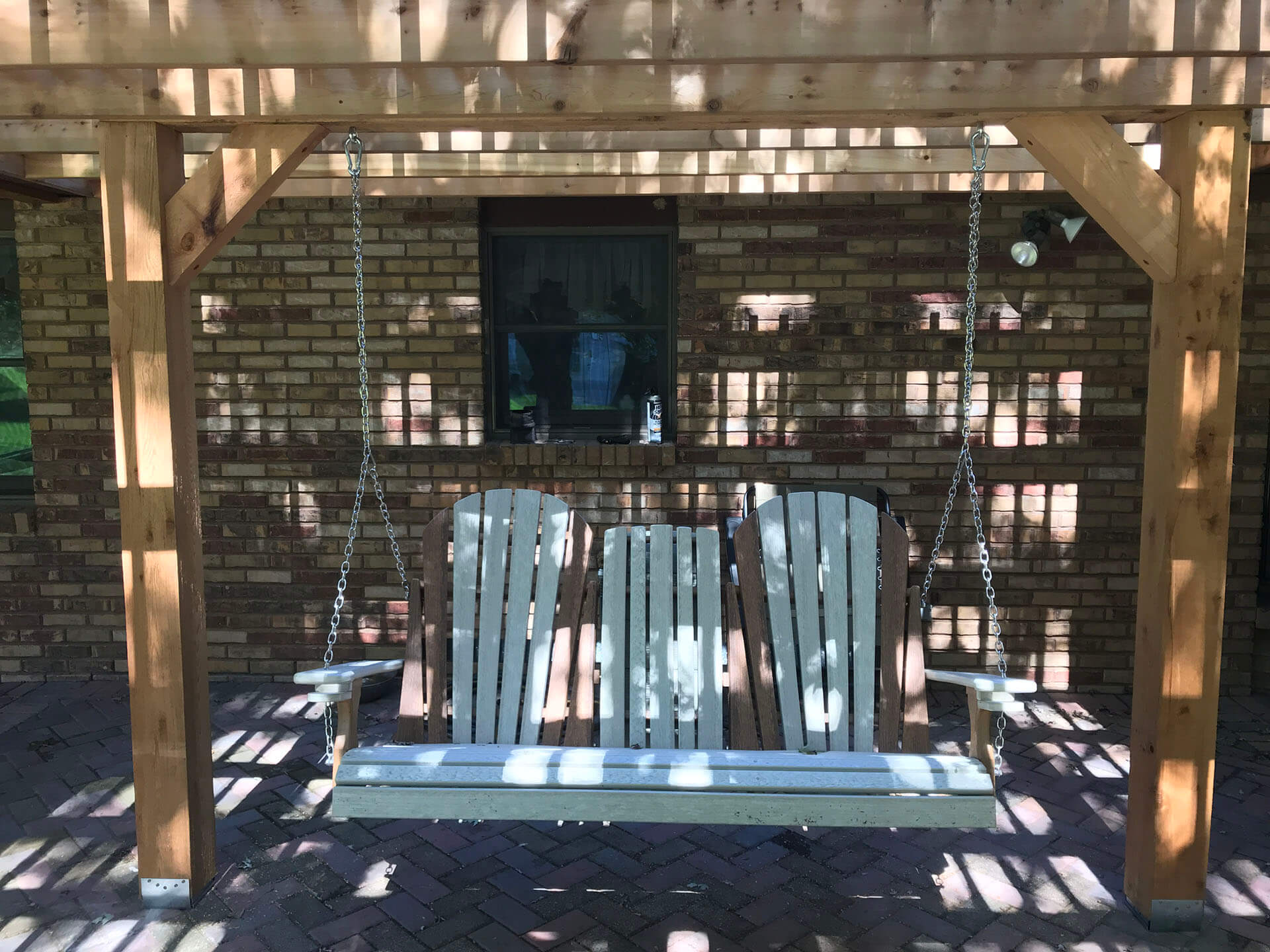 porch swing installed on a brick patio Cape Girardeau, MO Project