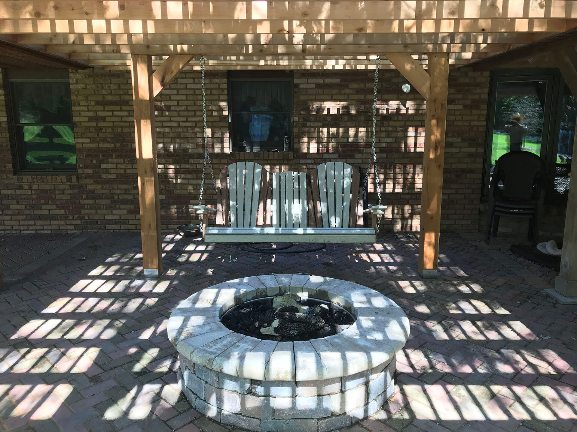 fire pit and swing on a brick patio Cape Girardeau, MO Project