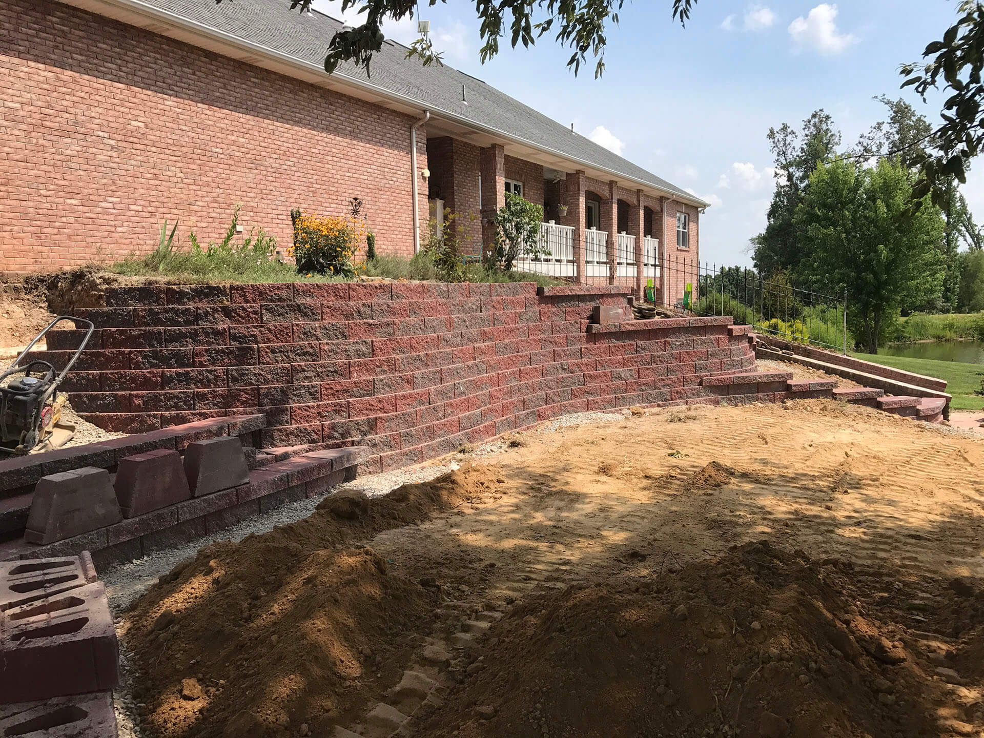 interlocking stone retaining wall at a home in Dexter, MO Project
