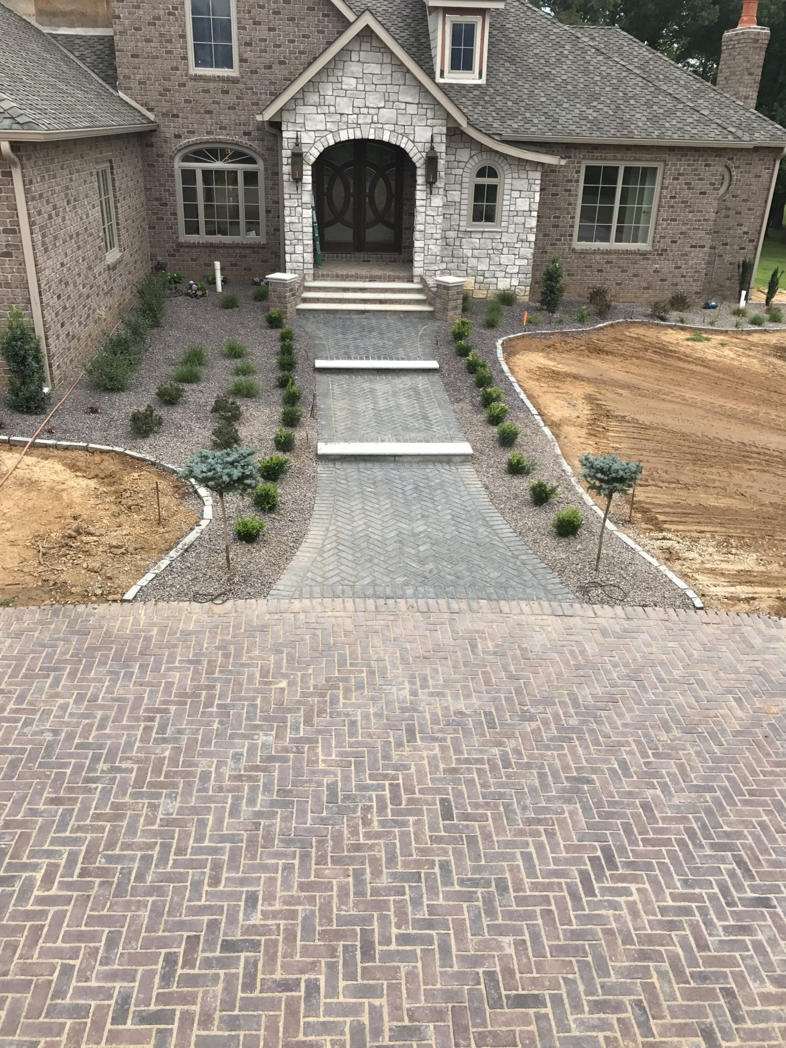 stone driveway and landscape features for a home in Poplar Bluff, MO
