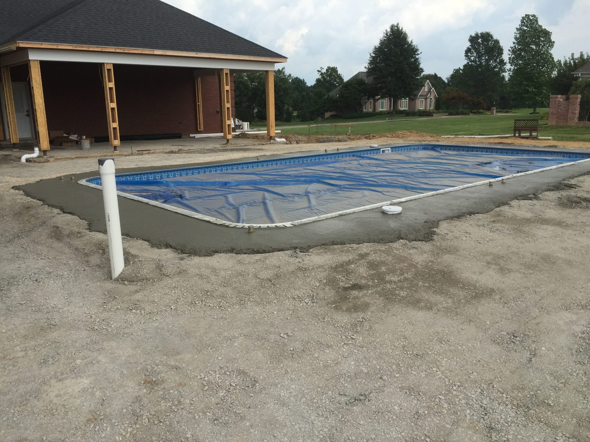preparing the gorund for the installation of a natural stone pool deck in Dexter, MO 1