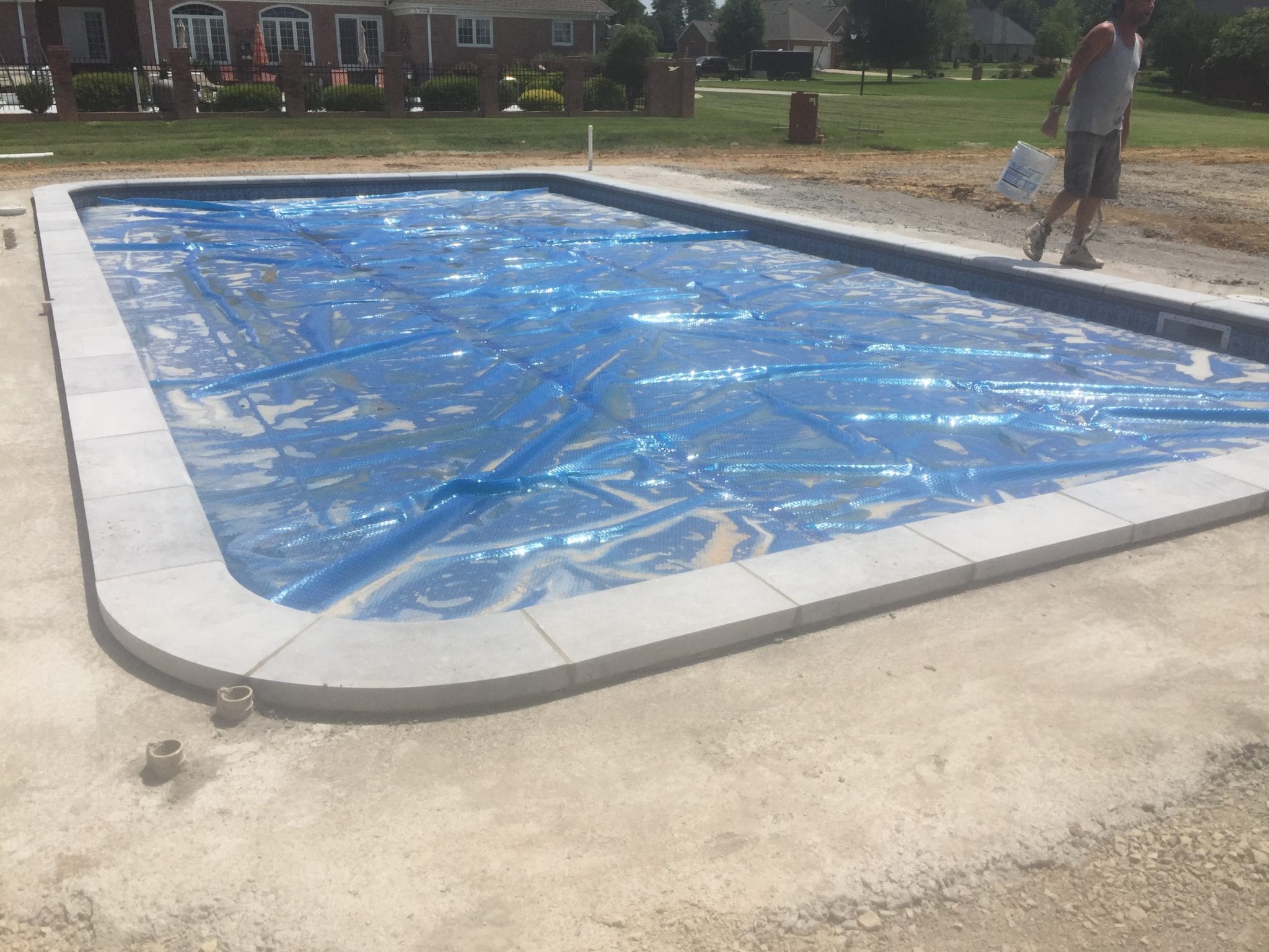 preparing the surface to construct a stone pool deck in Dexter, MO 1