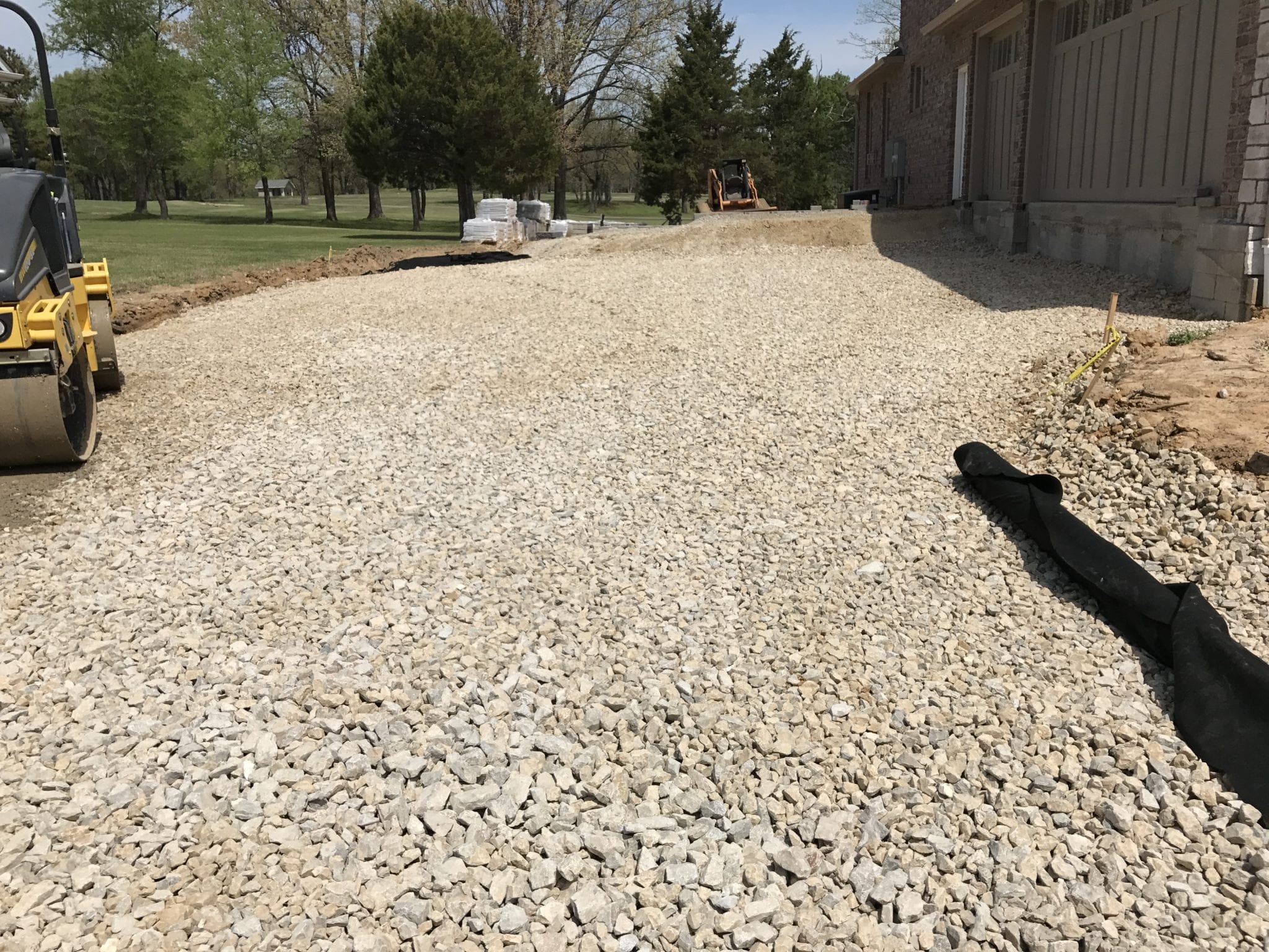 preparing the ground surface for a stone driveway for a home in Poplar Bluff, MO