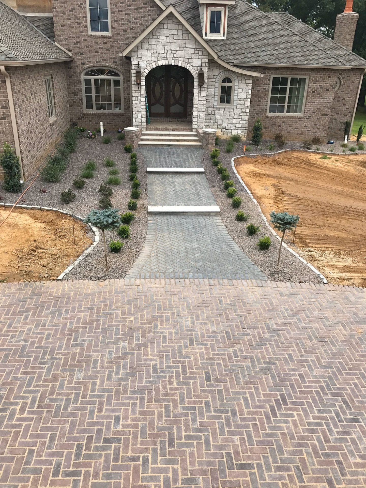 Large paver driveway and front sidewalk