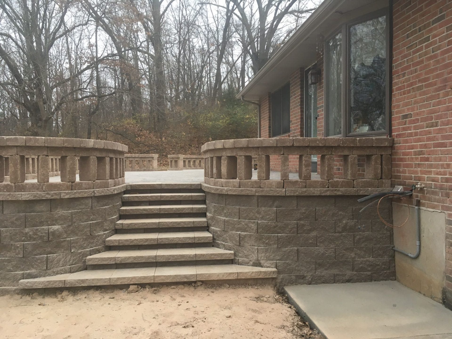 Raised patio with steps and seat wall